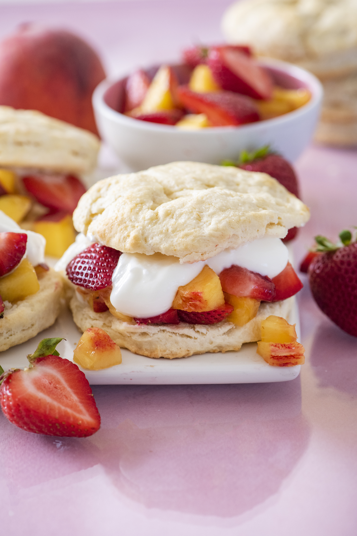 Peach & strawberry shortcake on a serving plate.