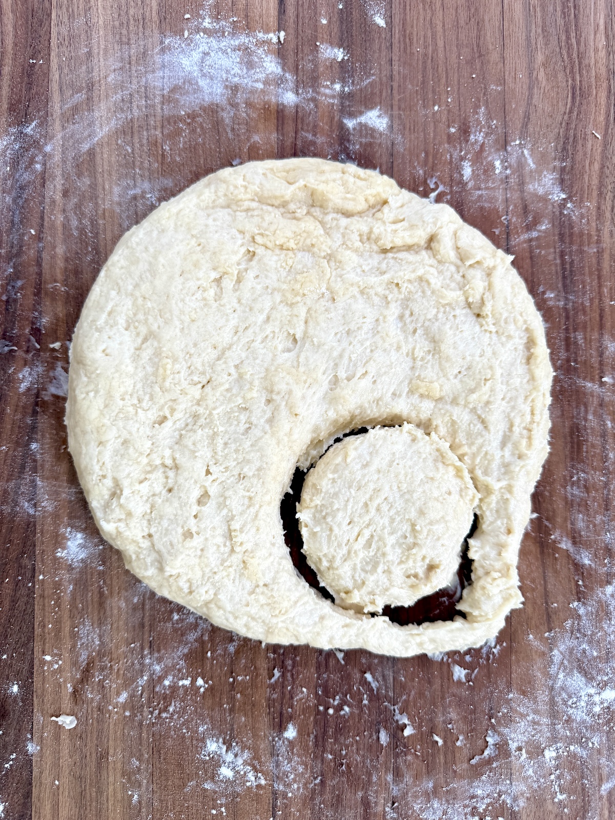 Shortcakes dough with a cut out piece.