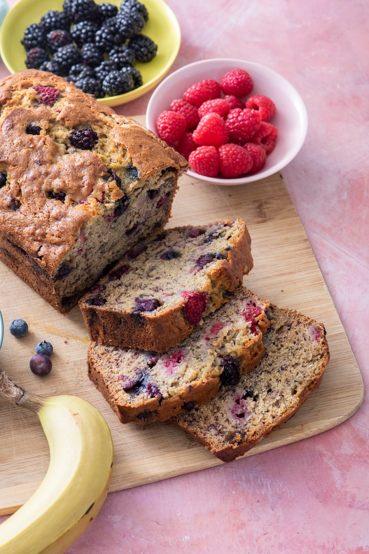 Banana Berry Bread on cutting board.