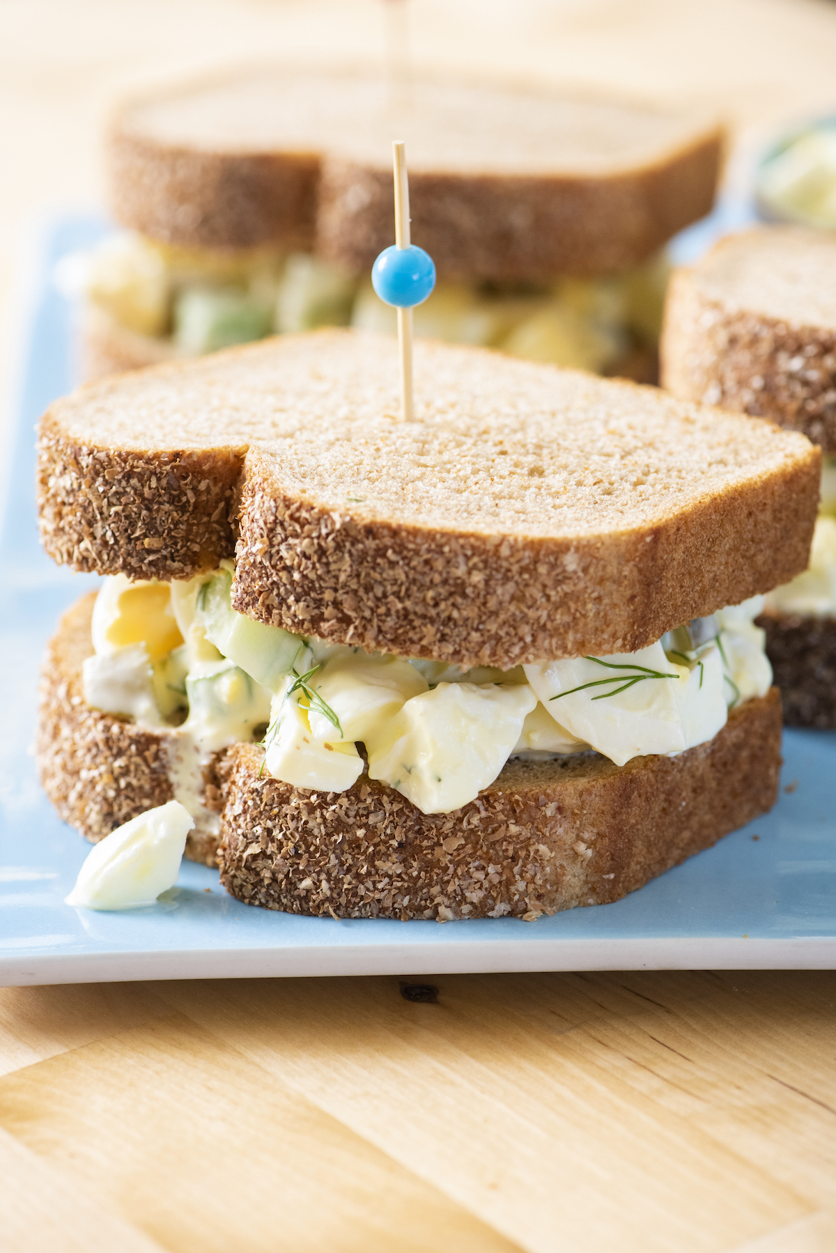 Egg salad sandwich on a plate.
