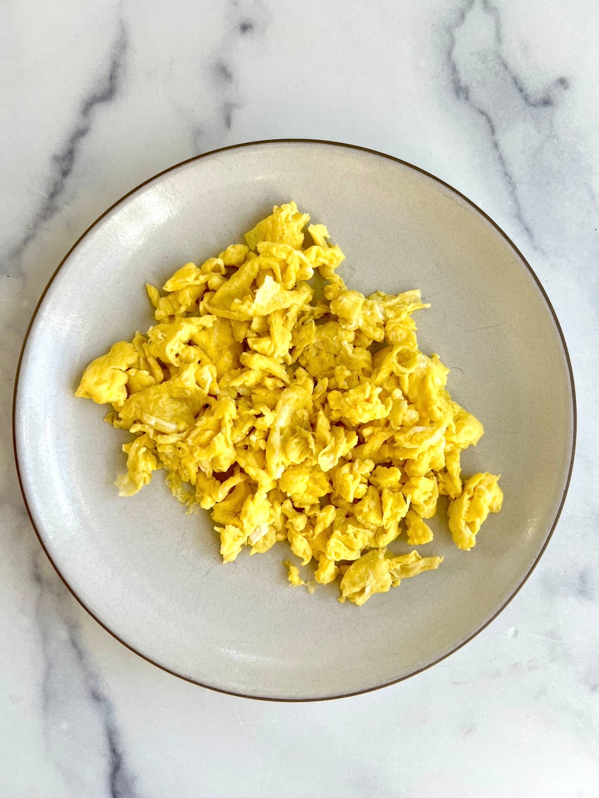 Scrambled eggs on a plate.