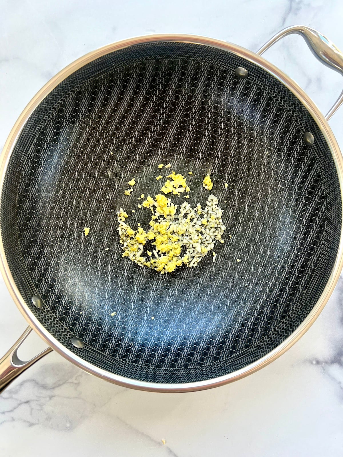 Ginger and garlic in saute pan.