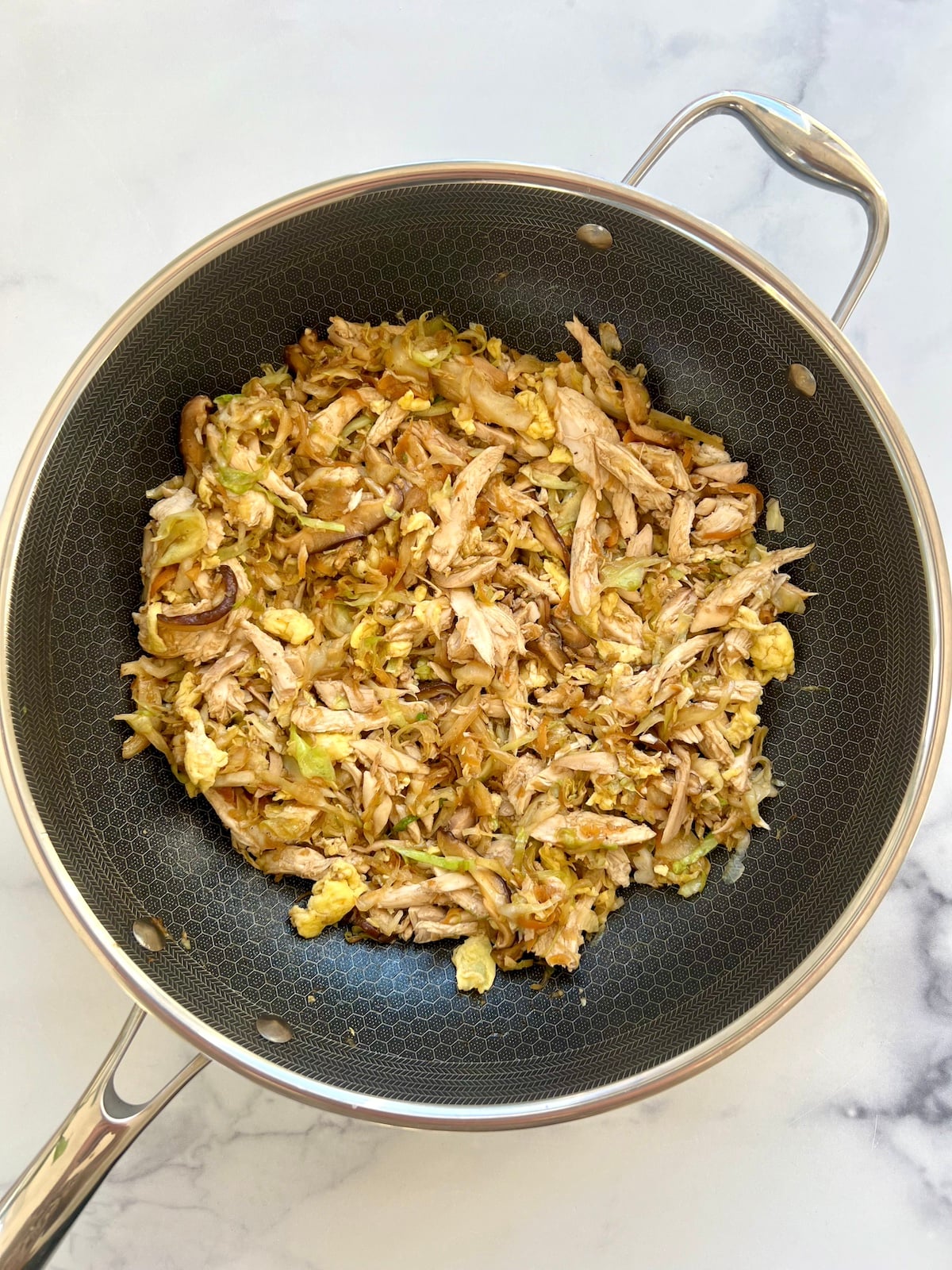 Mu shu chicken in sauté pan.