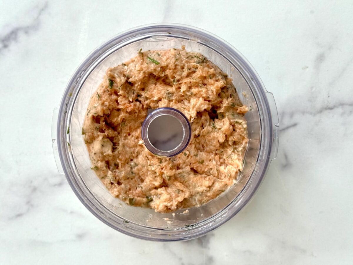 Salmon burger mixture in a food processor.