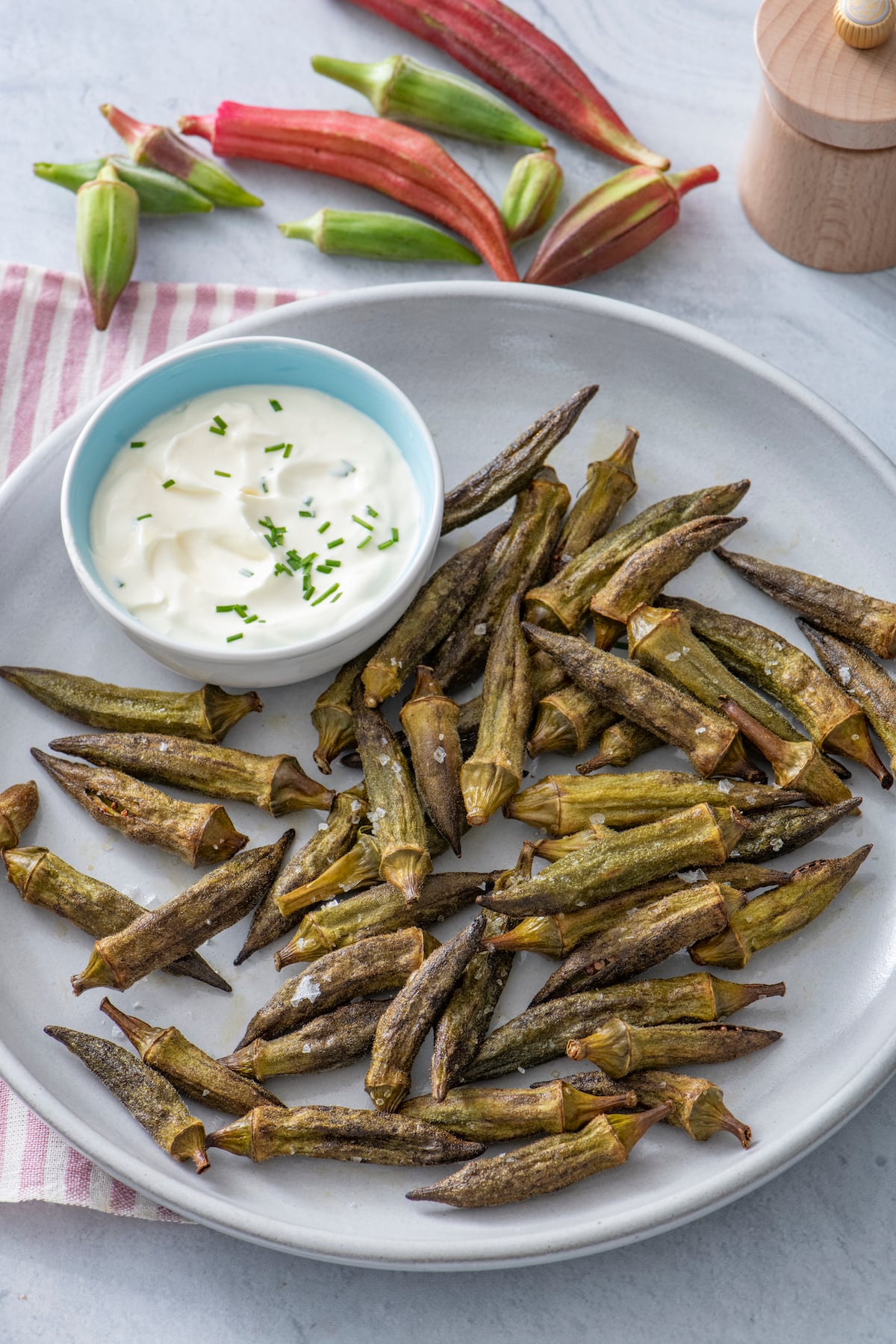 Air Fried Okra on serving platter with side of veggie dip.