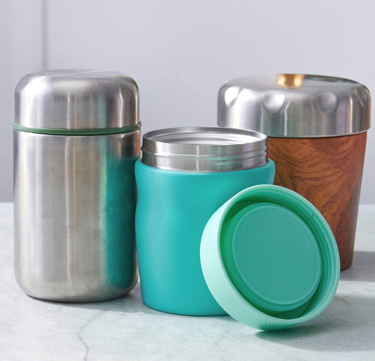 Three thermoses lines up side by side.