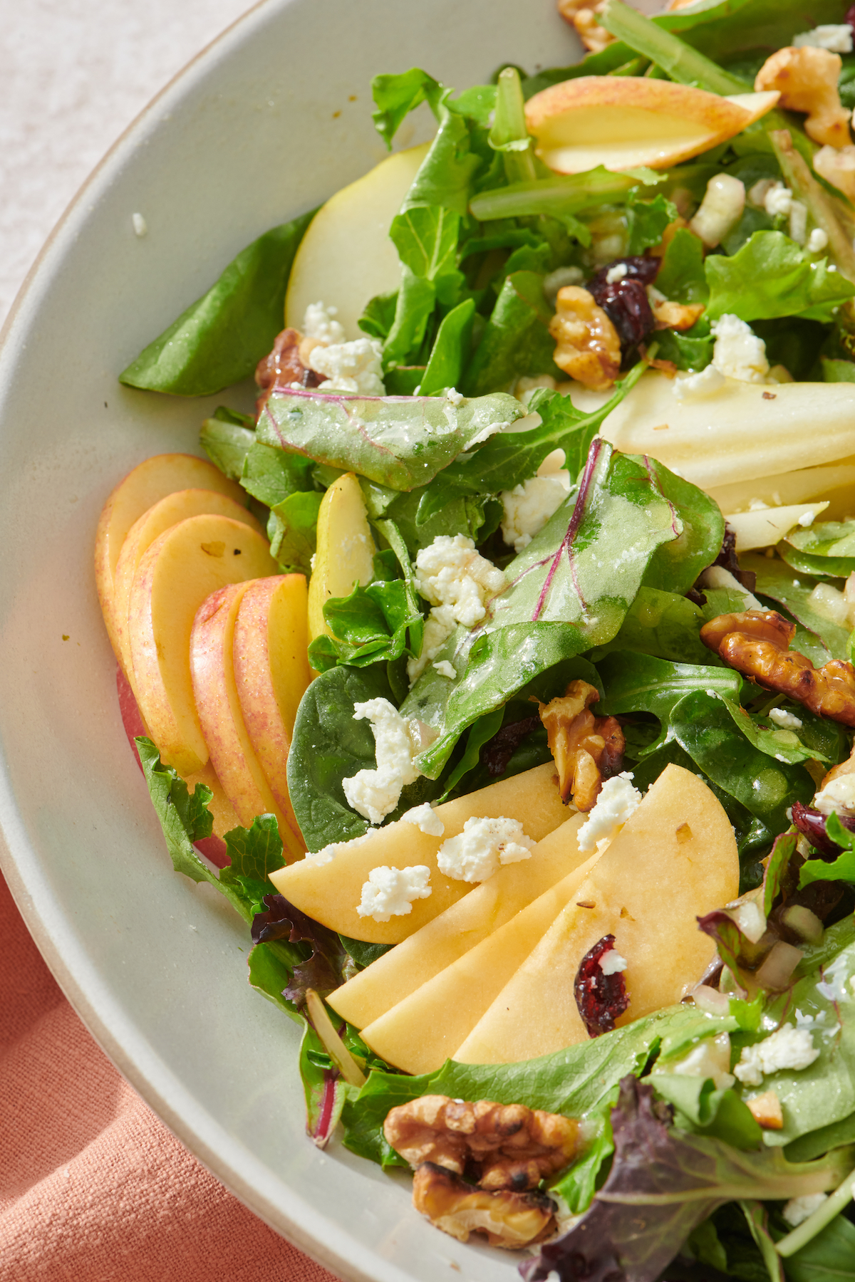 Apple, Pear and Goat Cheese Fall Salad in serving bowl.