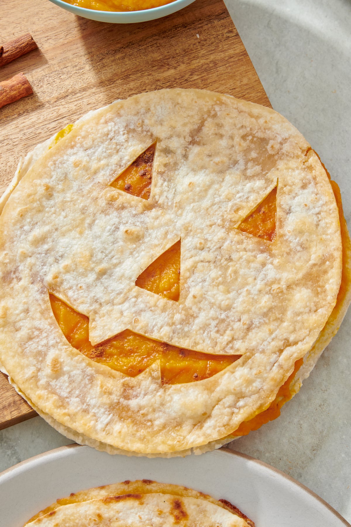 Jack-o'-lantern quesadilla with pumpkin purée filling