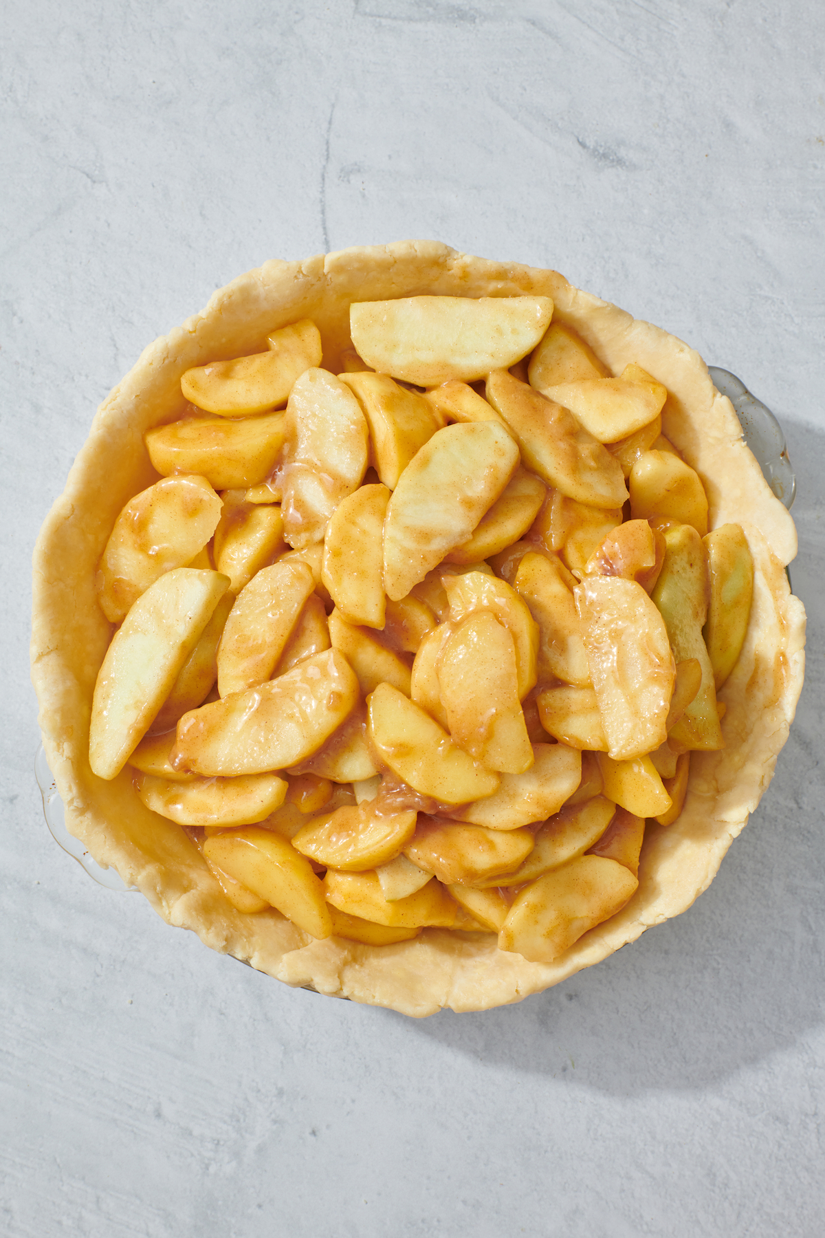 Apple pie filling in a pie crust.