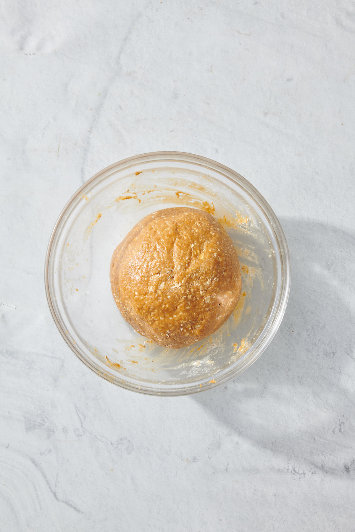 oats, peanut butter and honey mixed to form large ball.