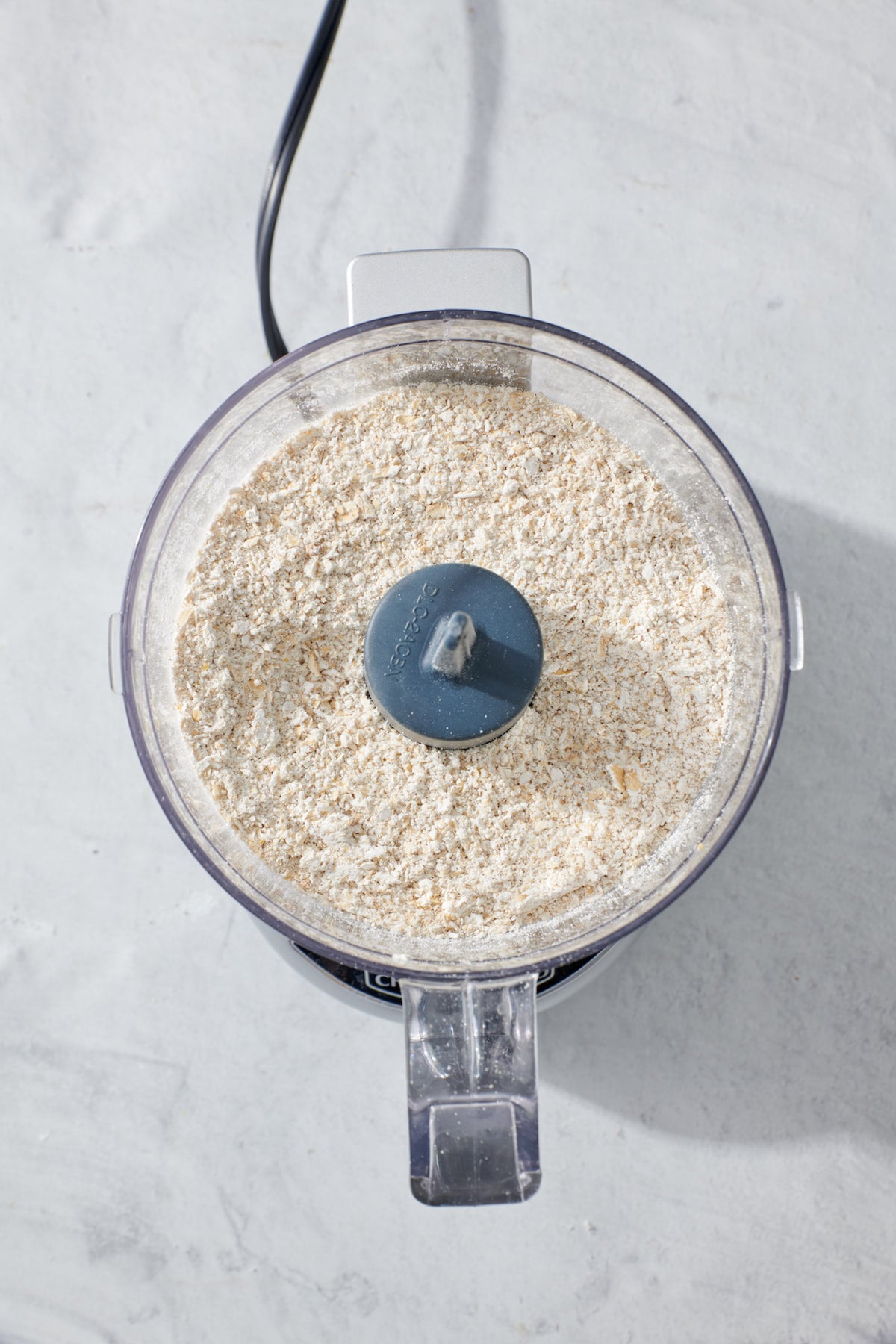 Ground oats in food processer