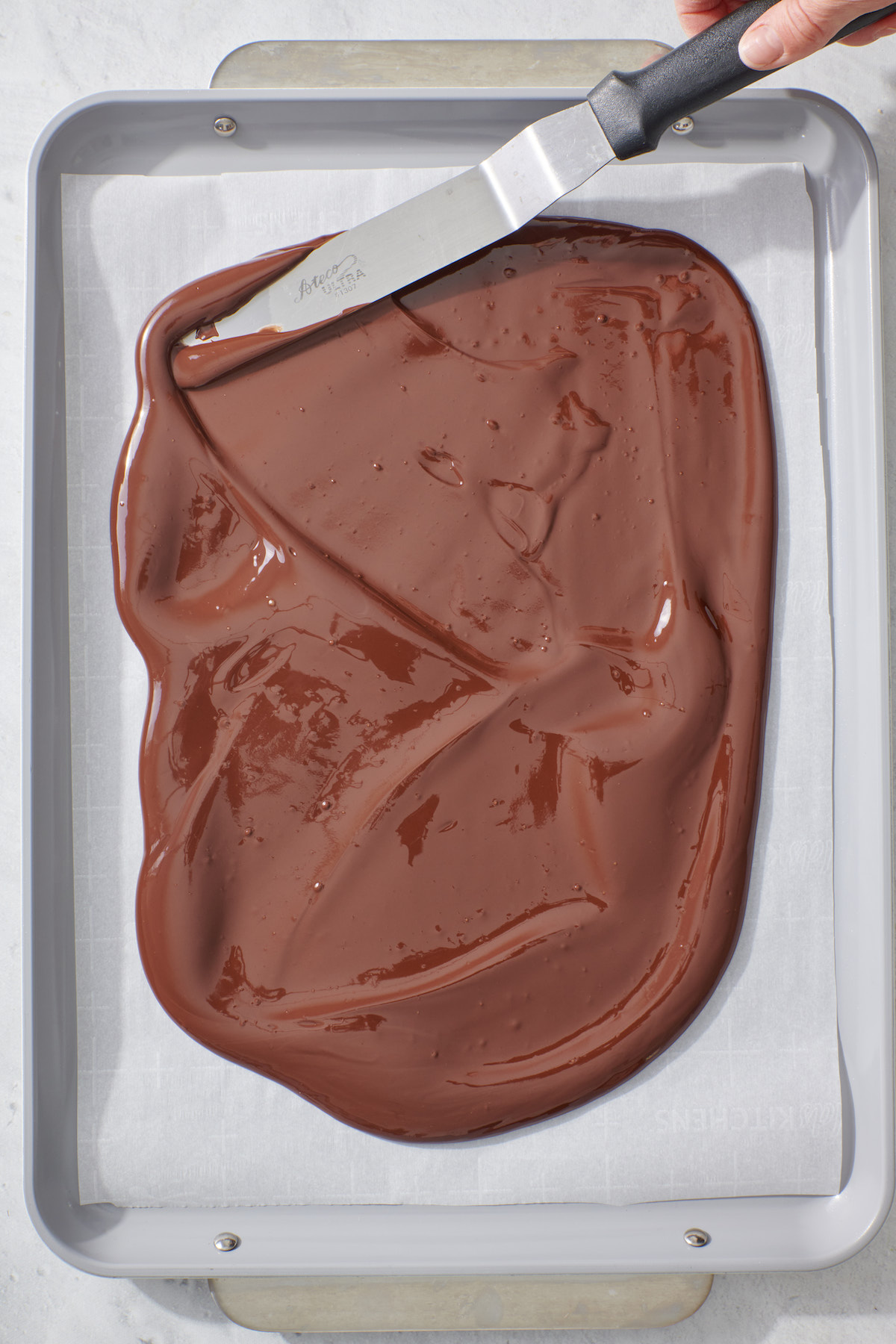 Melted chocolate on baking sheet.