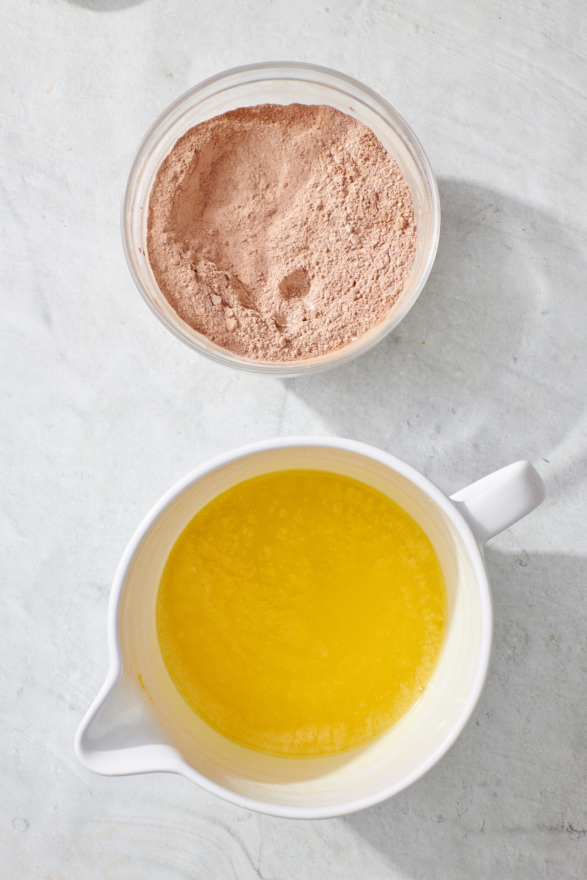 Dry ingredients combined in mixing bowl. Wet ingredients in separate bowl below.
