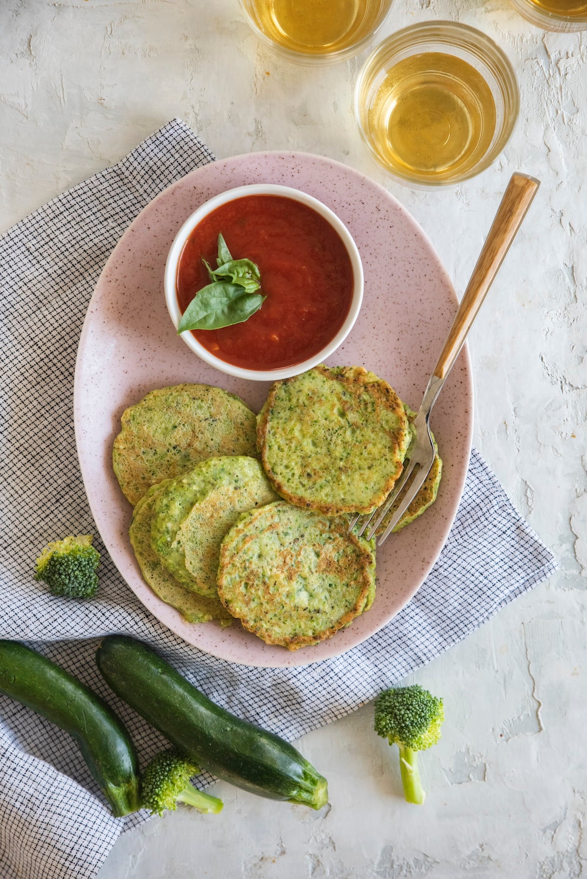 Green veggie pancakes on serving platter.