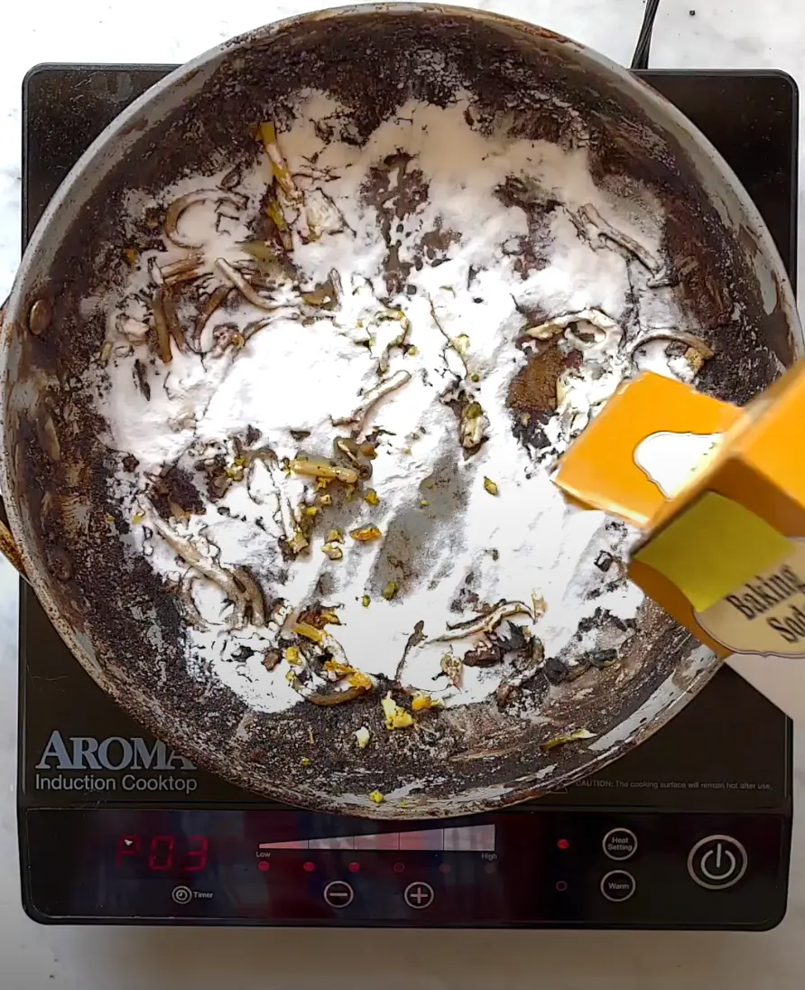 baking soda in sprinkled in dirty pan