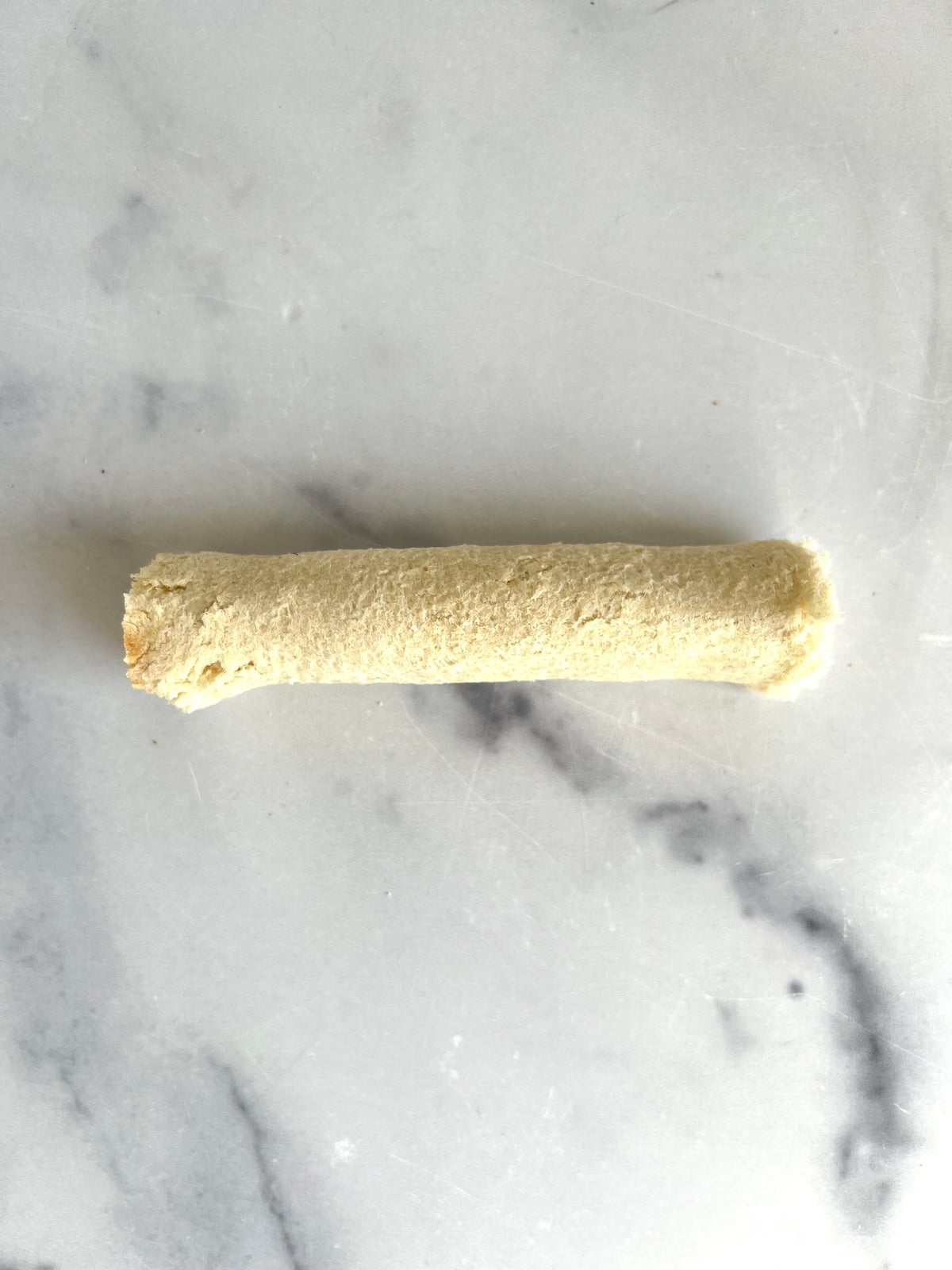 Pizza roll up ready to cook.