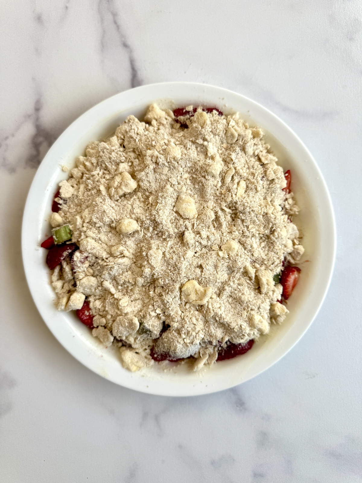 Strawberry rhubarb crumble before baking.