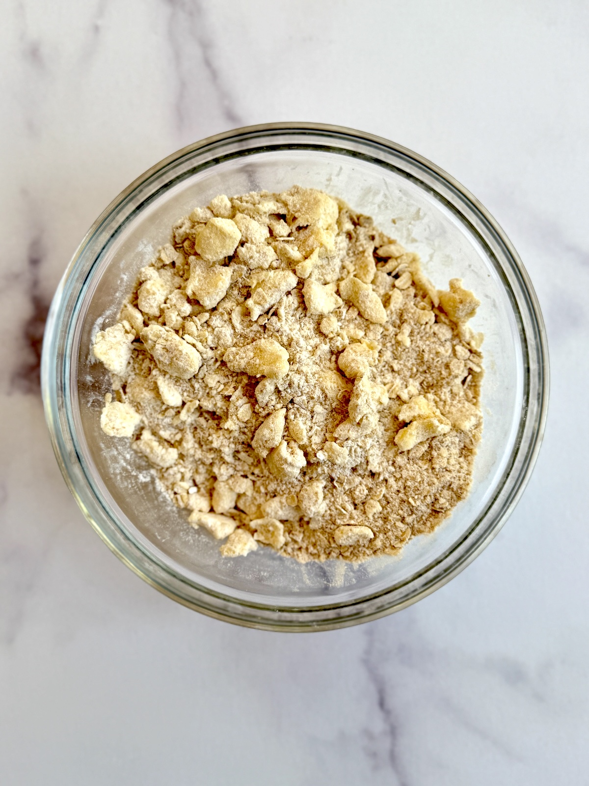 Strawberry rhubarb crumble topping in a bowl.