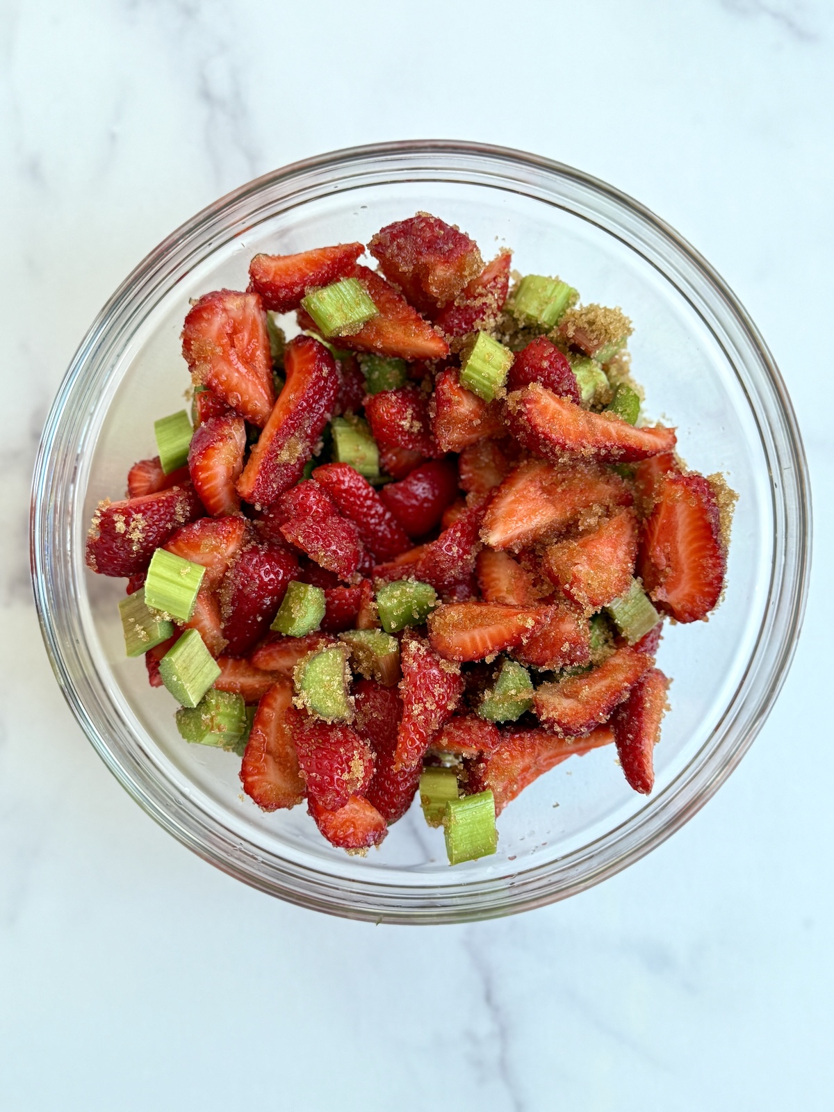 Strawberry and rhubarb crumble filling in a bowl.