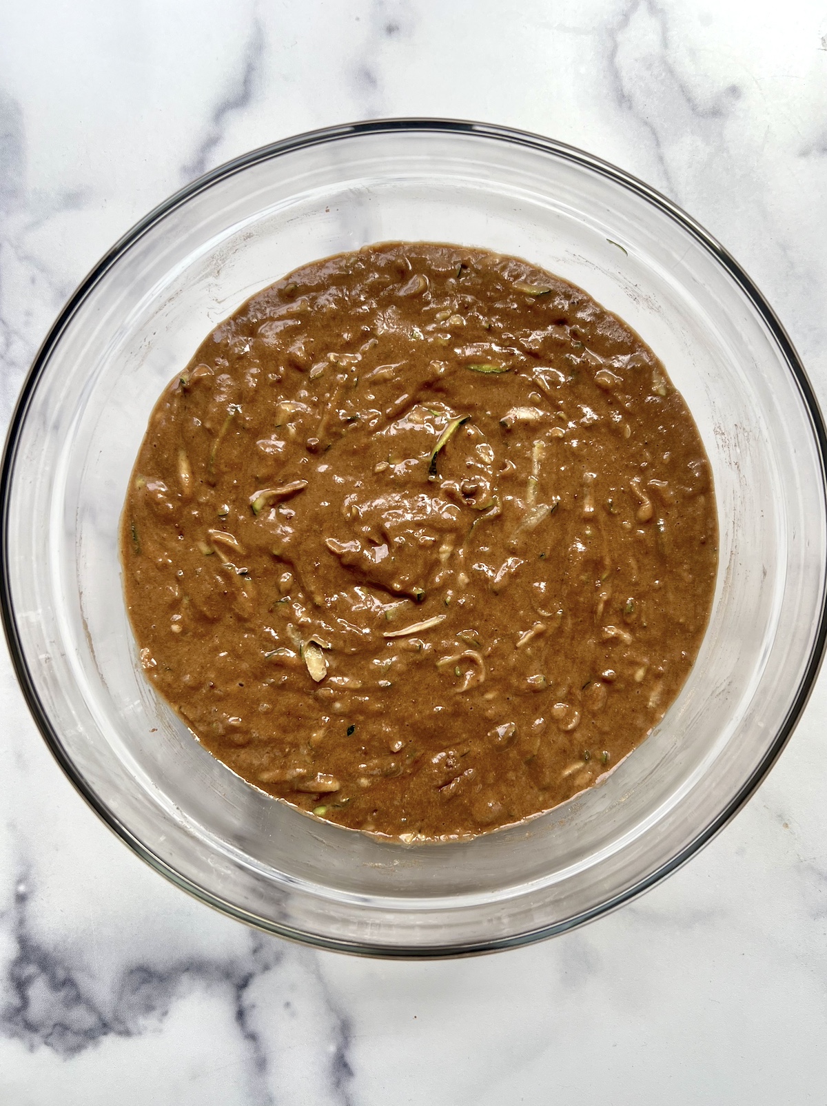 Chocolate zucchini bread batter in a mixing bowl.