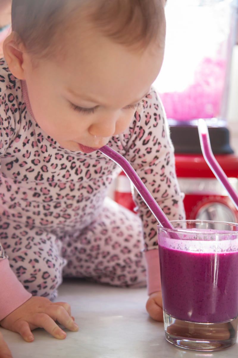 Toddler drinking smoothie.