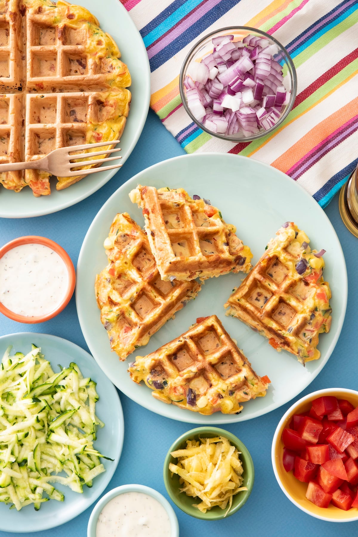 Rainbow waffle on a plate.