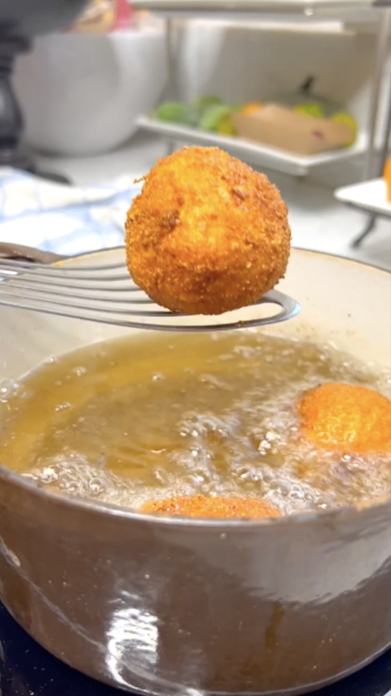 Shallow frying turkey croquettes.