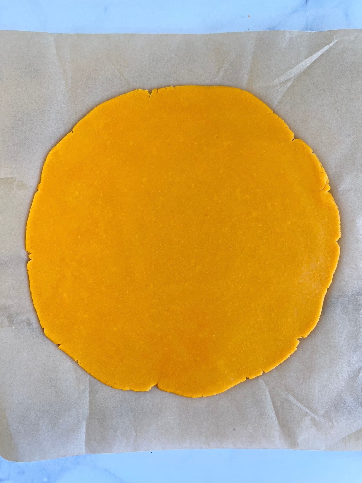 Rolled out cheese wafer dough.