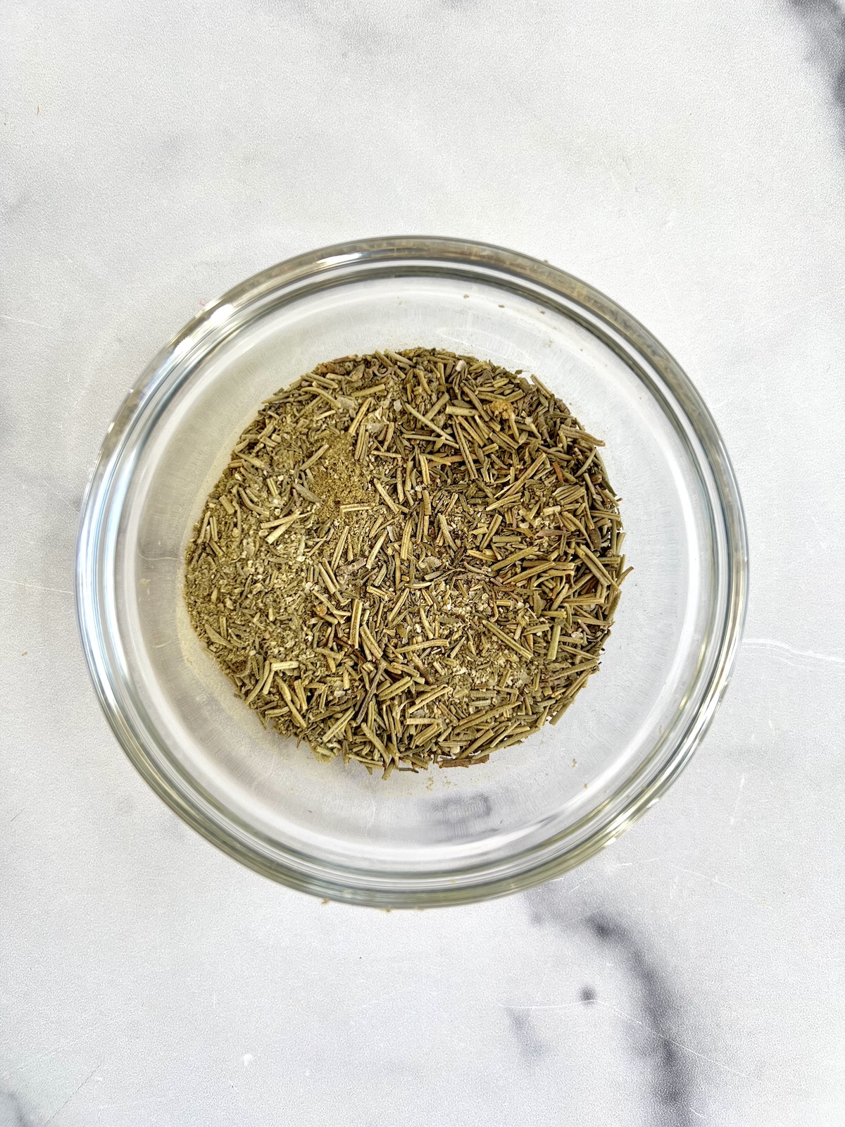 Dried herbs in a small prep bowl.