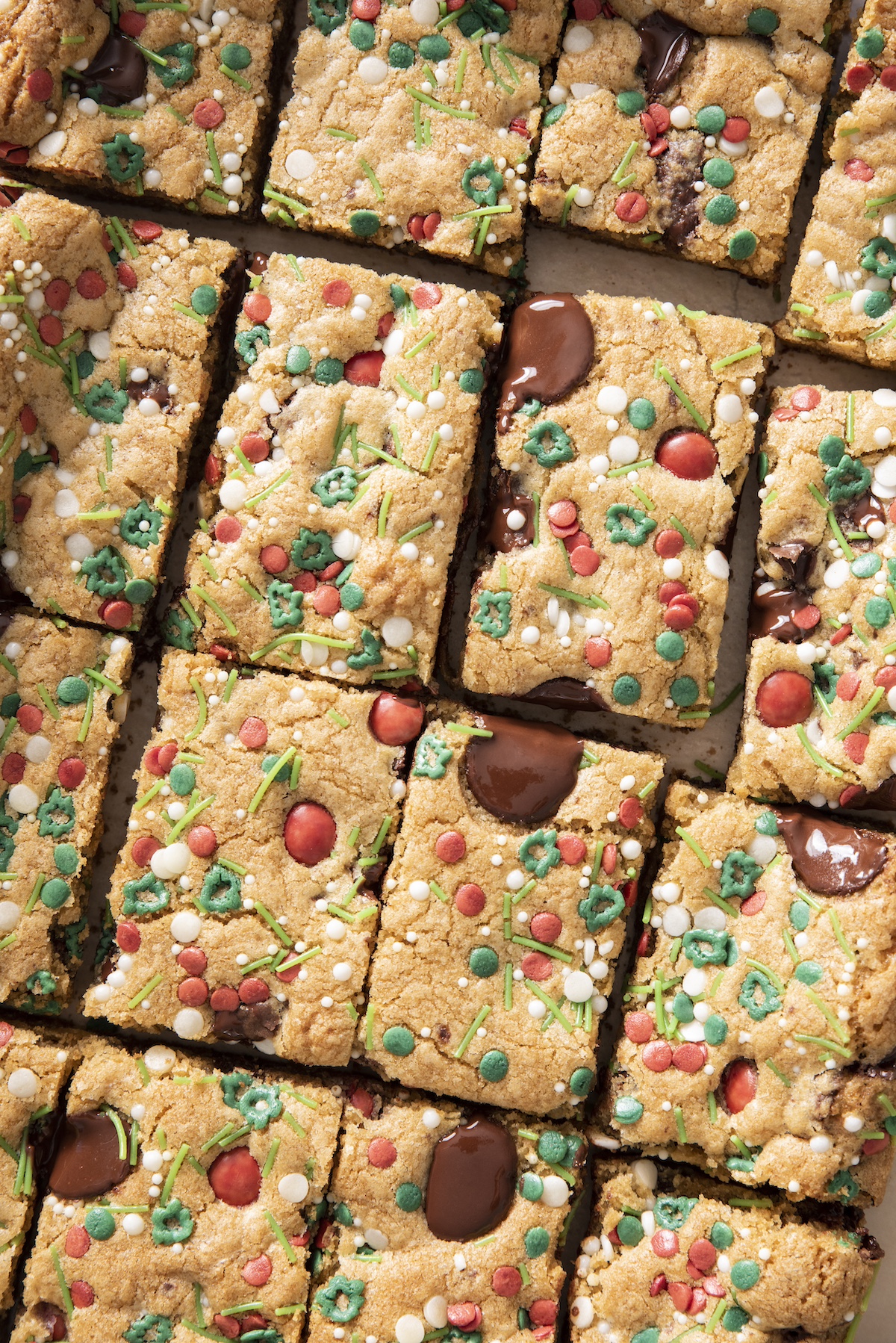 Holiday chocolate chip sprinkle bars cut into squares.