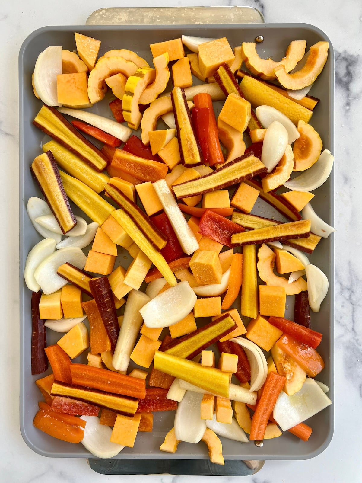 Diced veggies on a sheet pan.