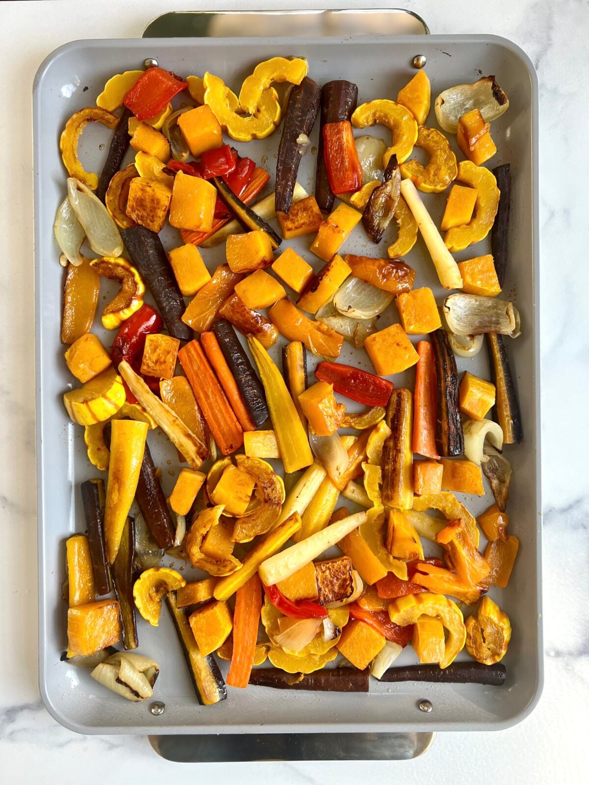 Roasted veggies on a sheet pan.