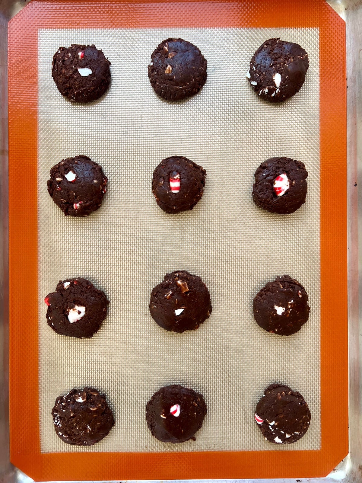 Unbaked cookies on a baking sheet.