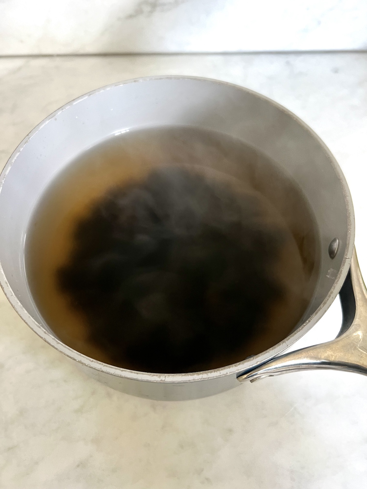 Boiling boba in saucepan.