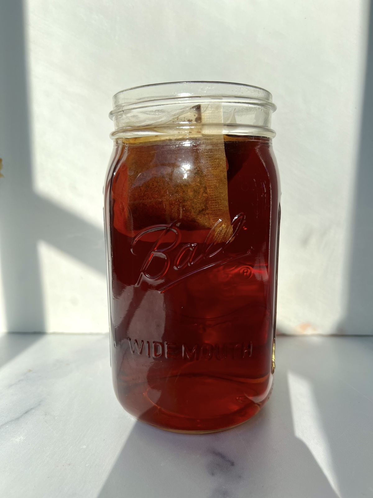 Steeping tea in large jar.