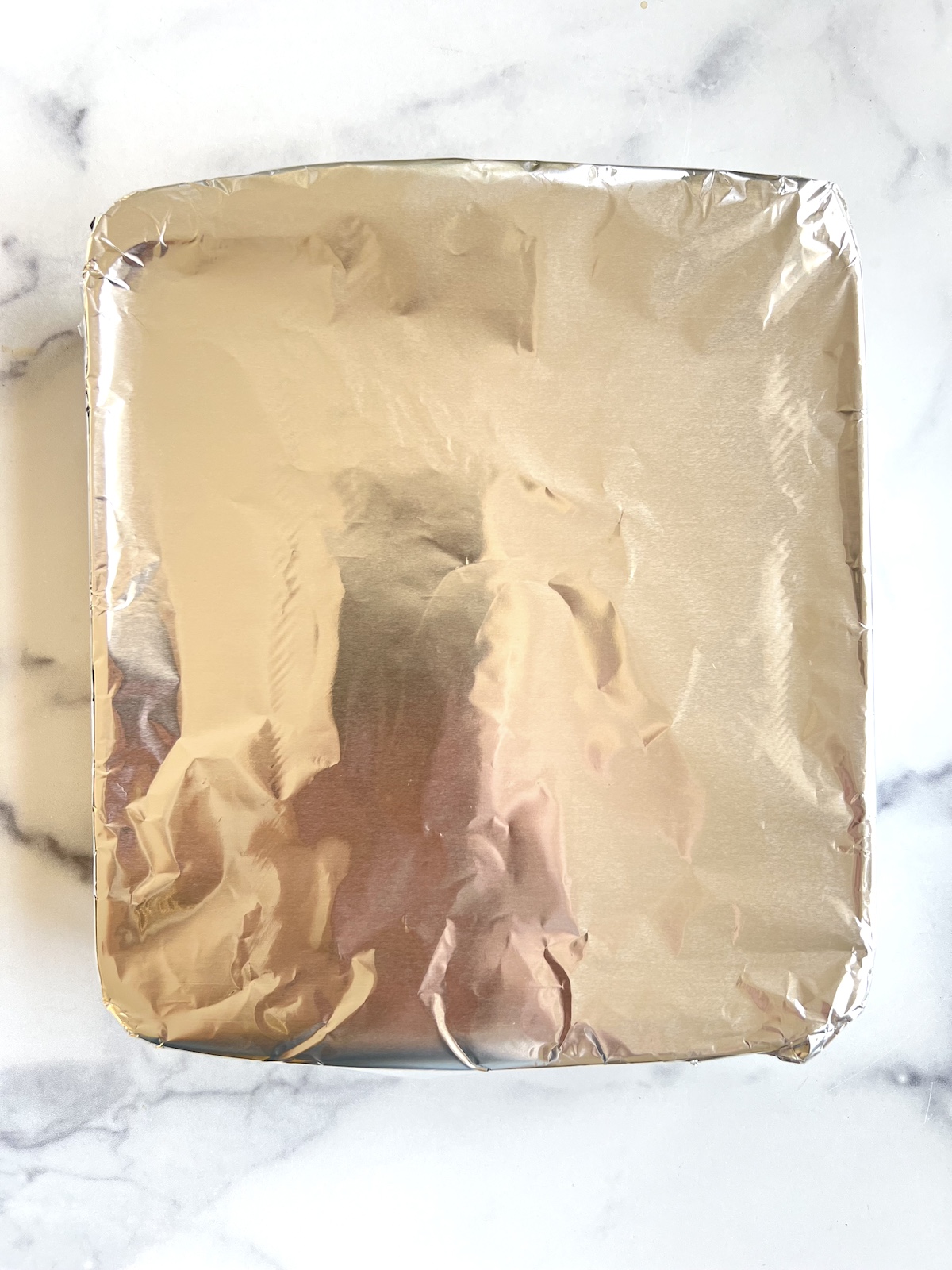 Foil covering a baking dish.