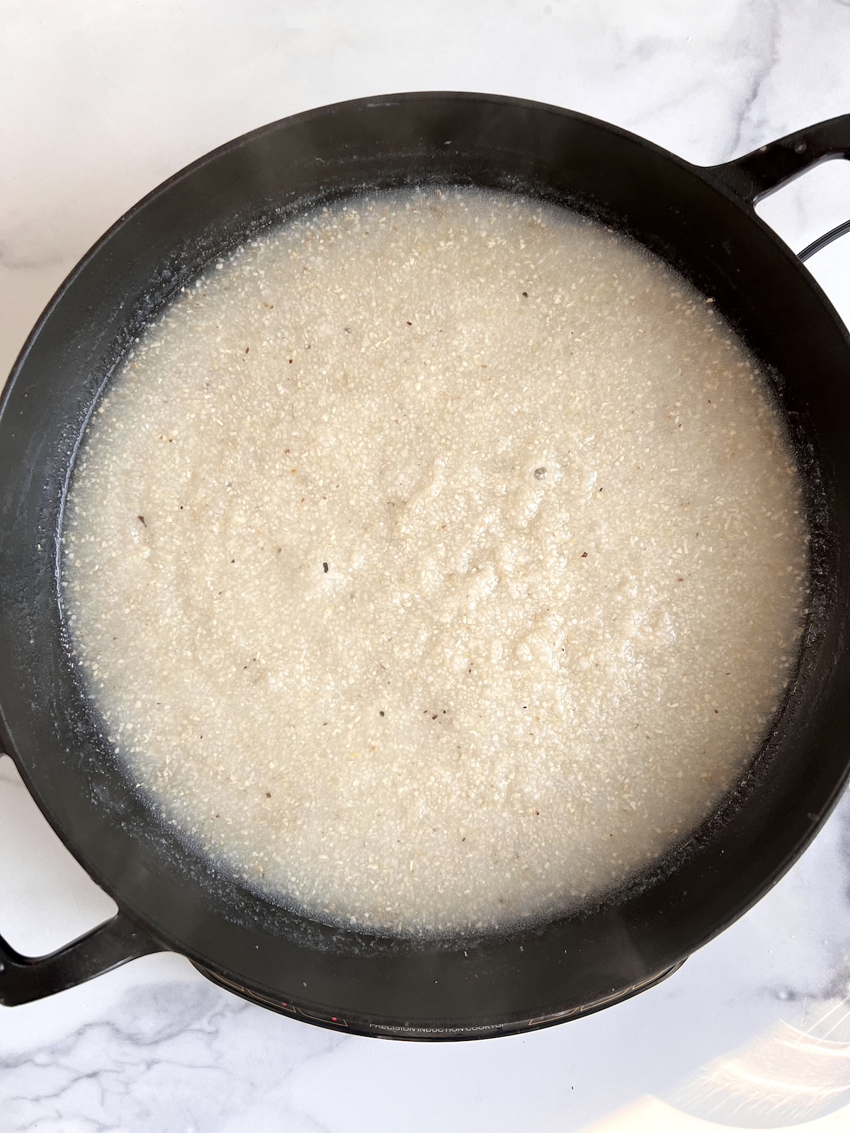 Cooked grits in a pot.