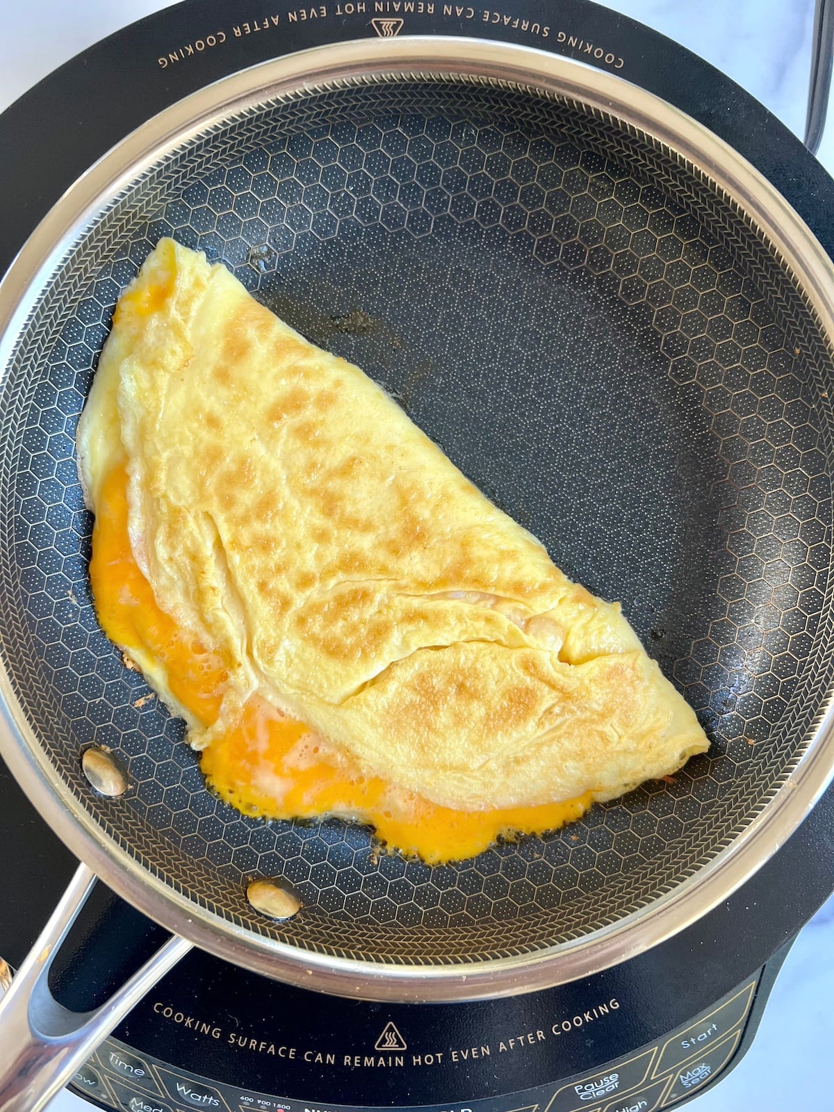 Finished omelette in a skillet.