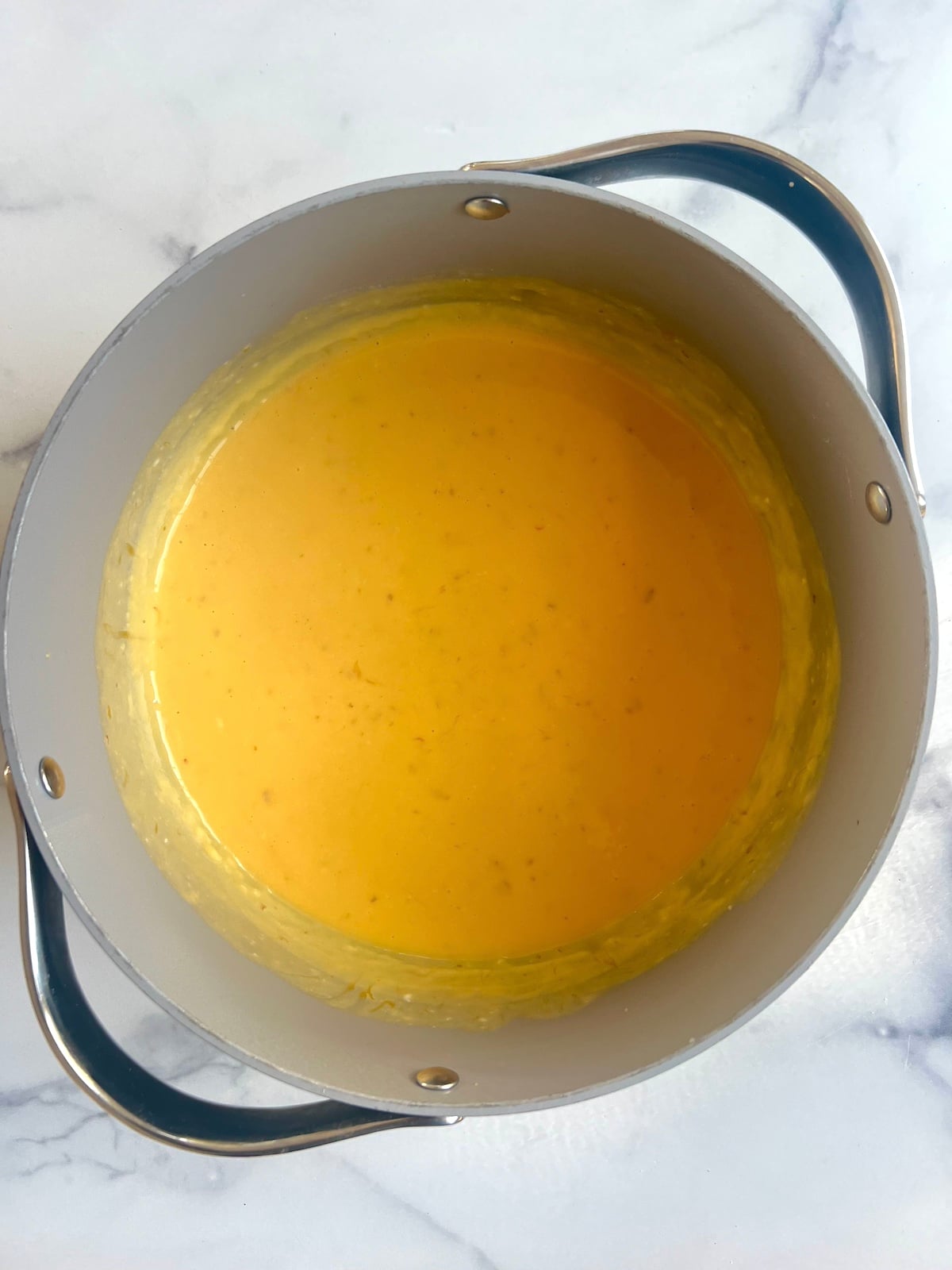 Cheese sauce in a pot.