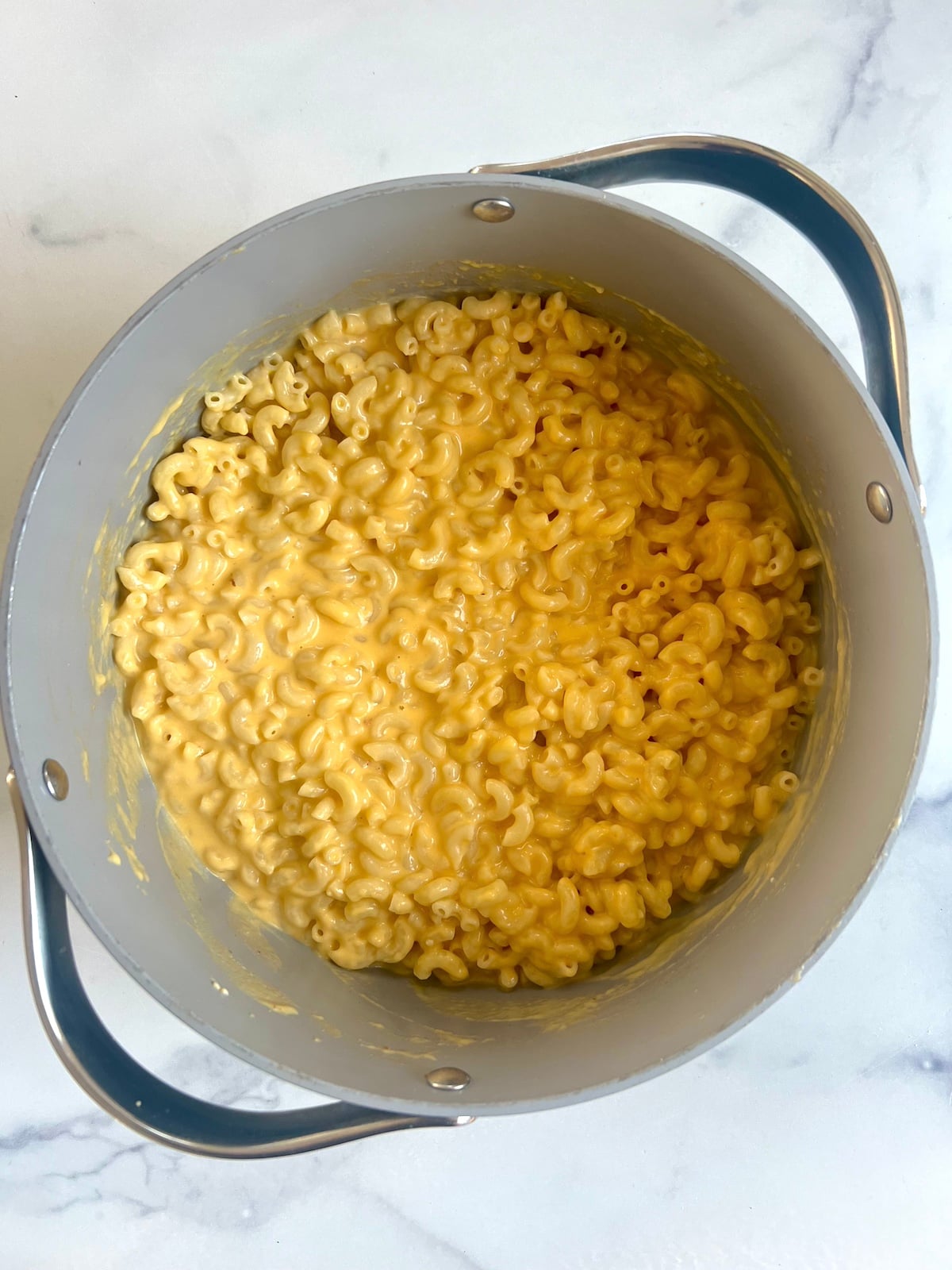 Macaroni and cheese in a pot.