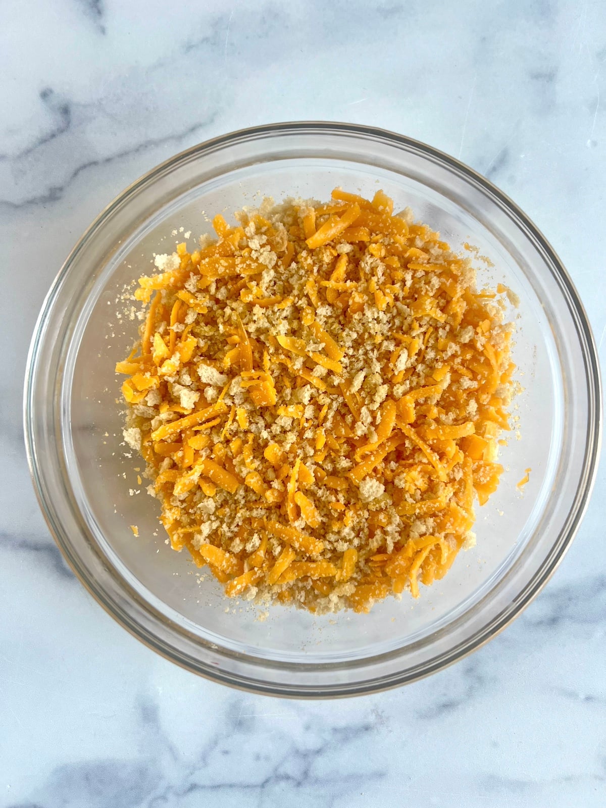 Cheese and breadcrumbs in a bowl.