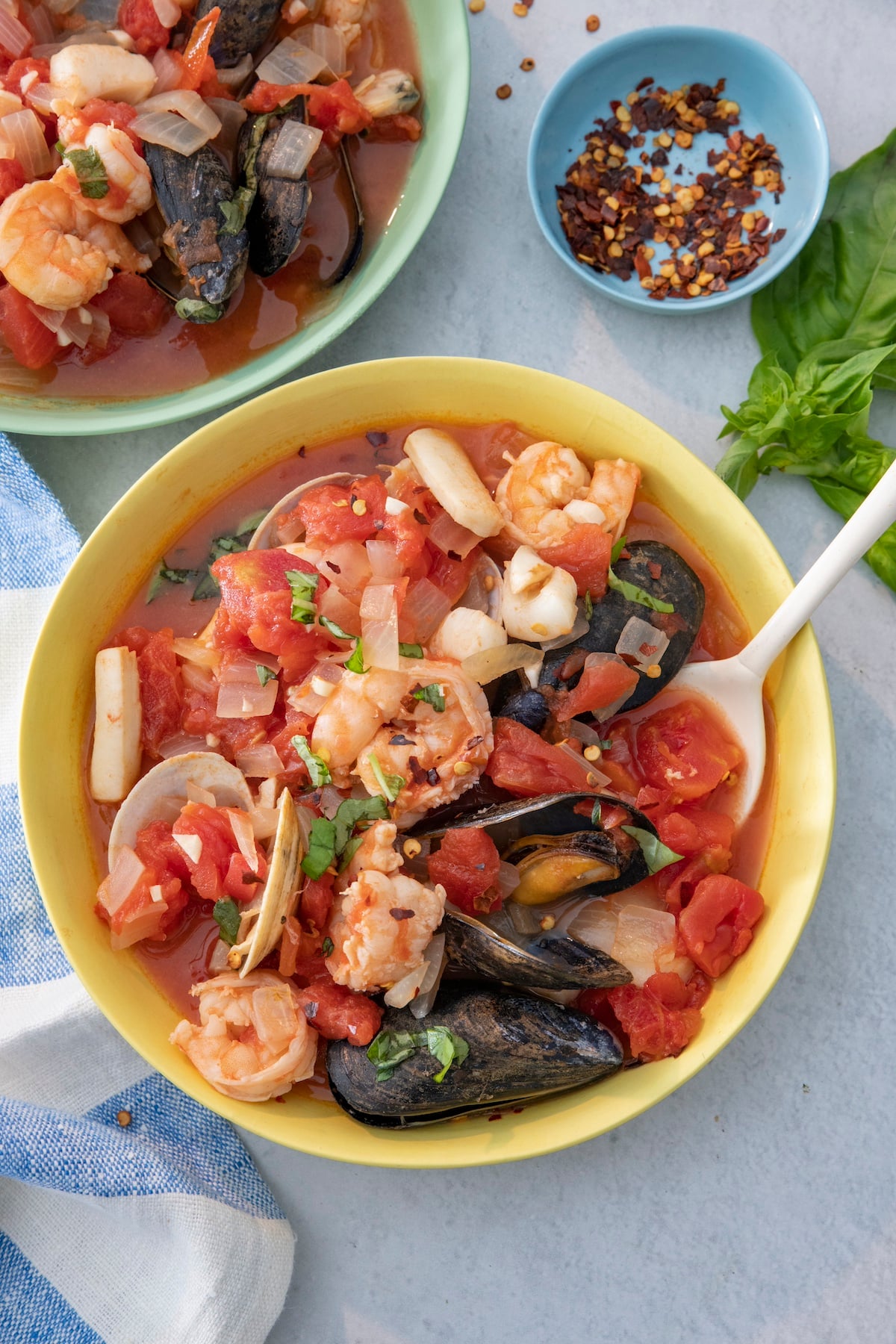 Seafood stew in serving bowl.