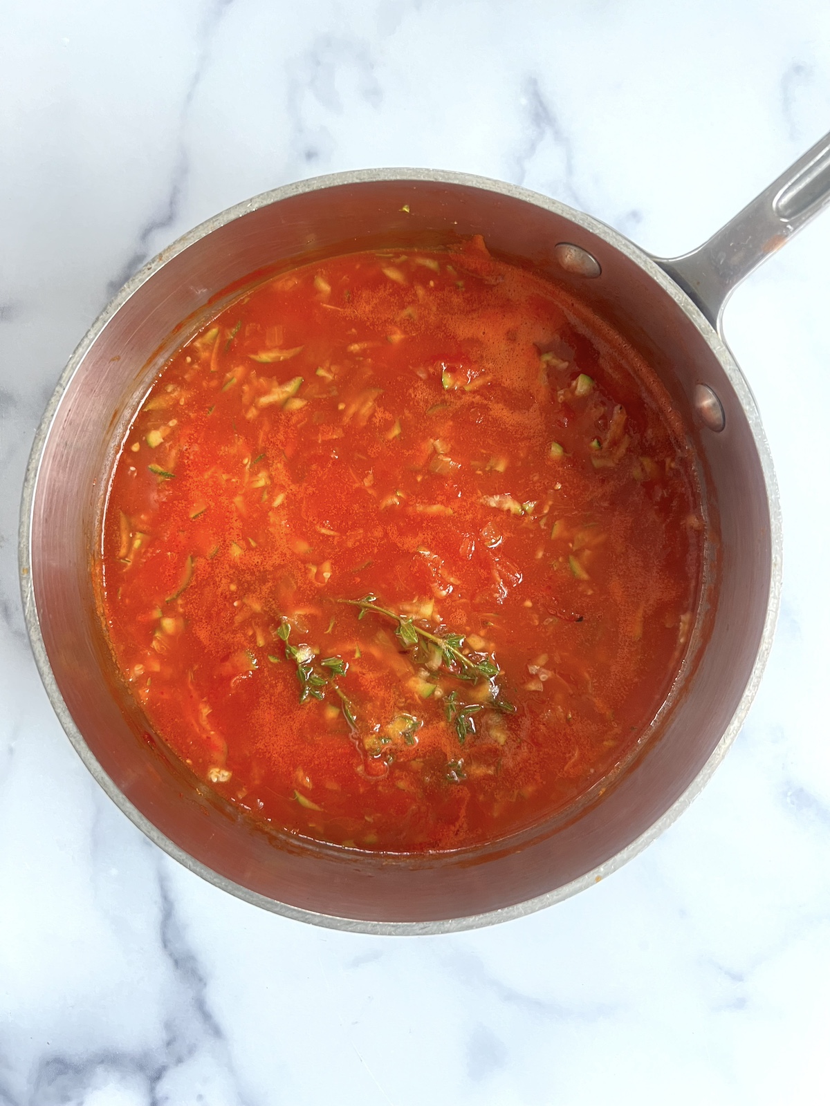 Tomato sauce in a sauce pan.