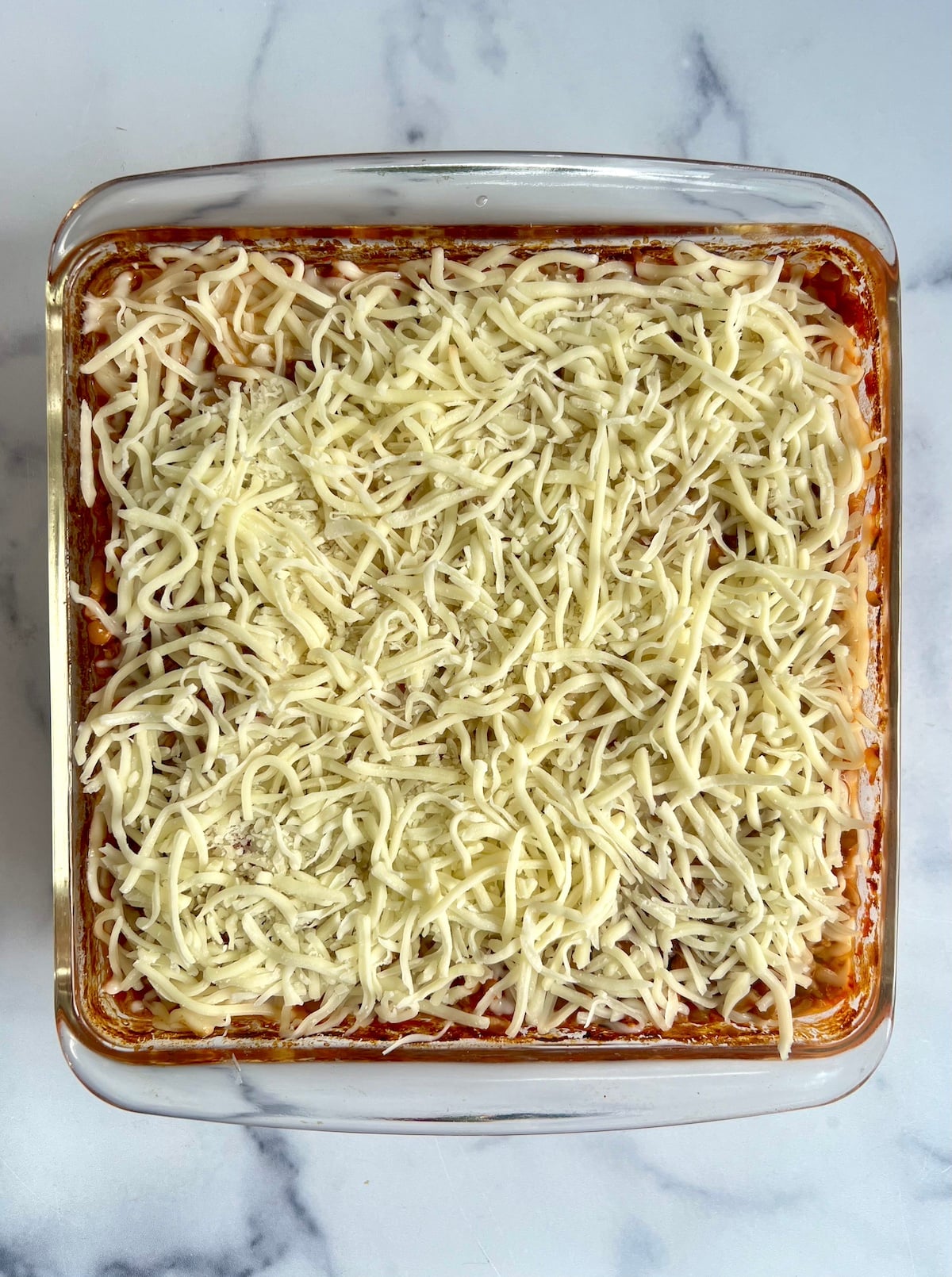 Baked farro topped with shredded mozzarella.