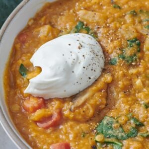Smoky red lentil stew in bowl.