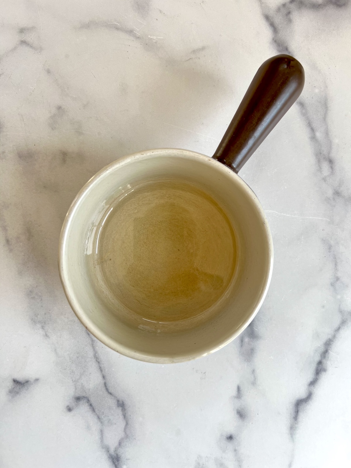 Sugar melted into water in a pot.