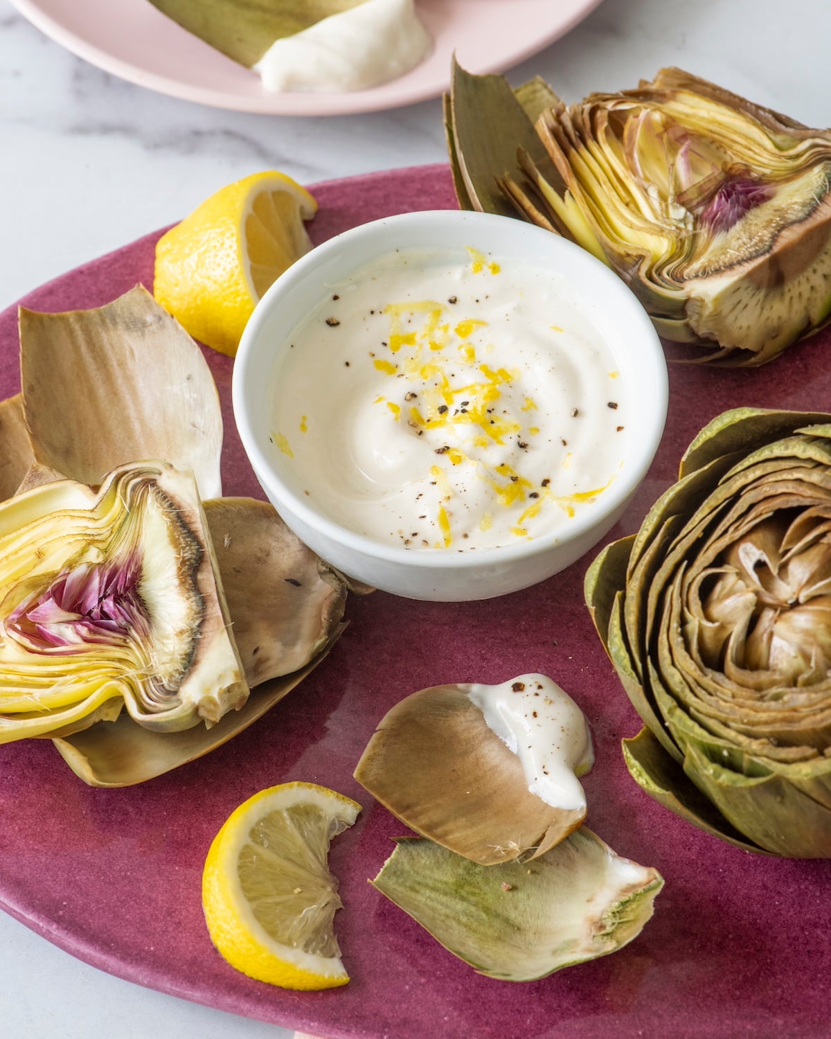 Steamed artichokes served with a lemon yogurt dipping sauce.