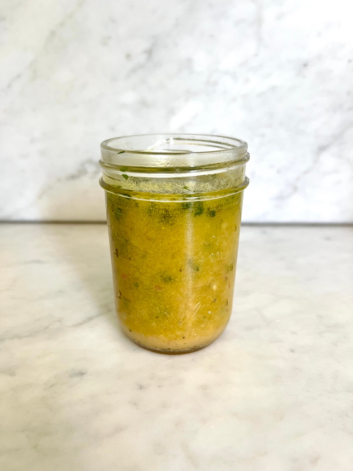 Citrus herb vinaigrette in a mason jar.