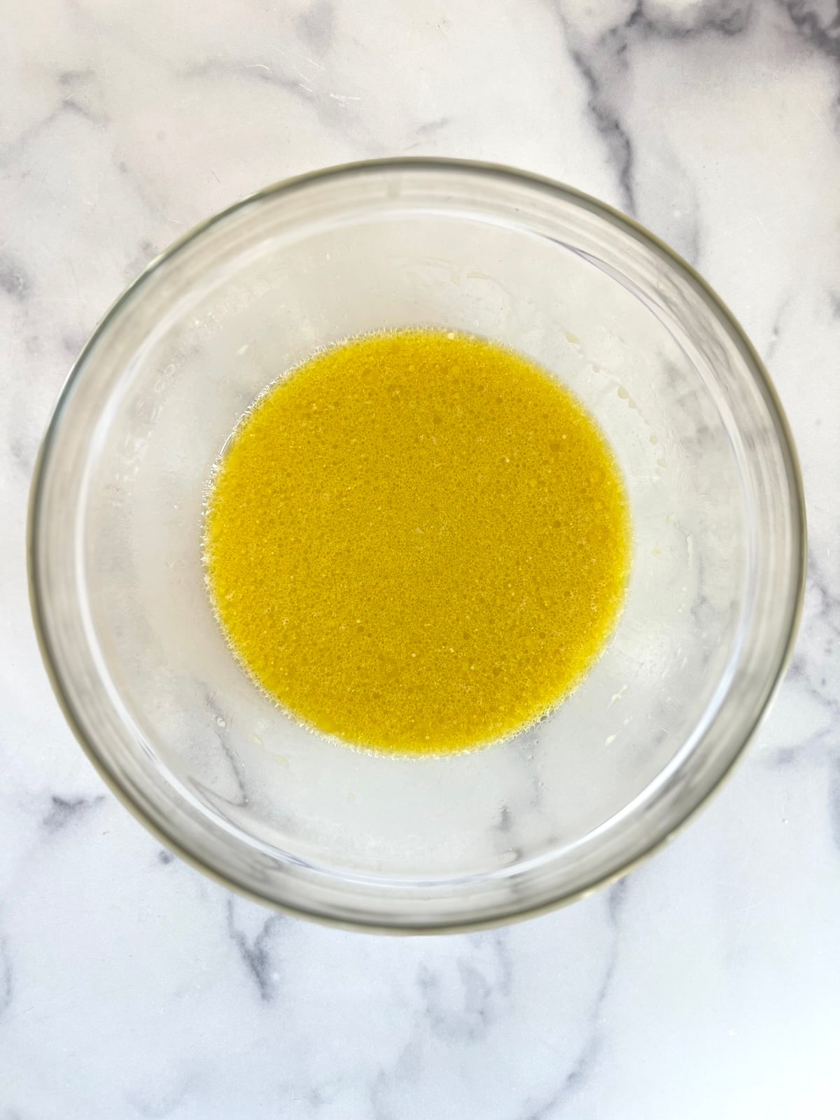 Very berry muffins wet ingredients in a bowl.