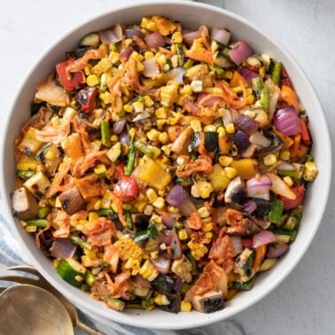 Grilled vegetable kimchi salad in a serving bowl.